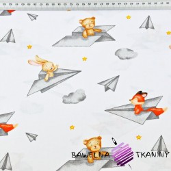 Cotton animals in paper planes on a white background
