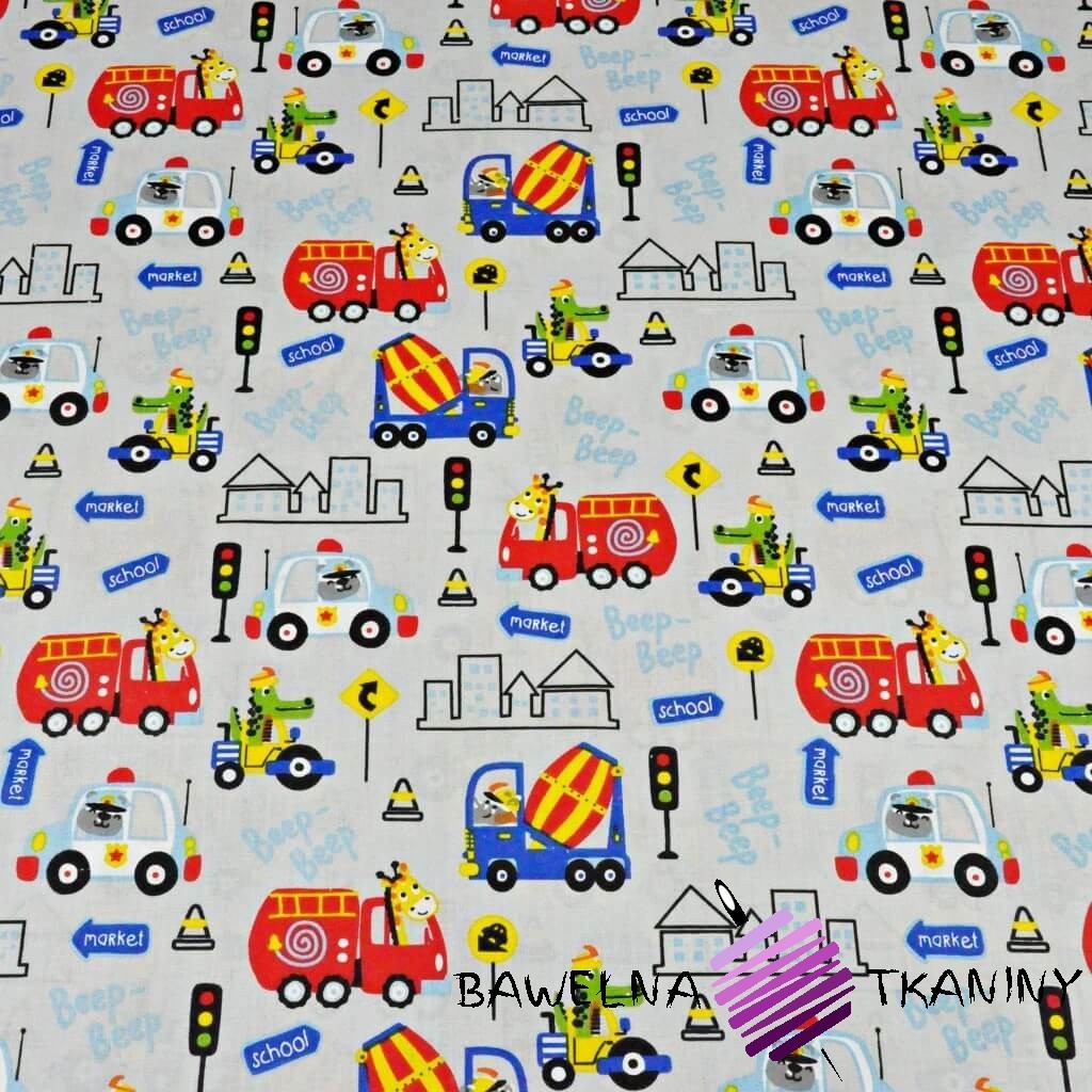 Cotton animals on colored vehicles on a gray background