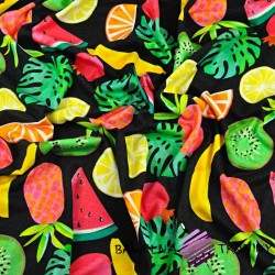 Cotton Jersey knit digital printing of tropical fruit on a black background