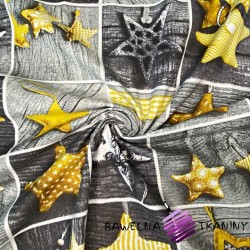 Patchwork Christmas pattern with yellow stars on gray board