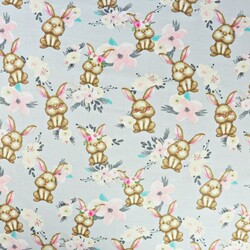 Cotton rabbits with bouquets on a gray background