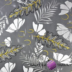 Cotton fern leaves with flowers on a gray background