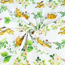 Cotton deer with hares and green leaves on a white background