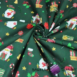 Cotton Christmas pattern Santa with gifts on a dark green background