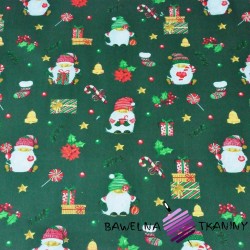 Bawełna wzór świąteczny mikołaje z prezentami na ciemno zielonym tle