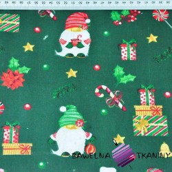 Bawełna wzór świąteczny mikołaje z prezentami na ciemno zielonym tle