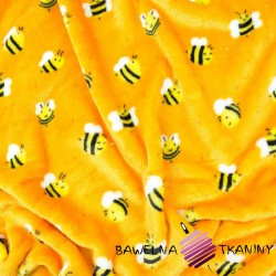 Soft fleece with bees on an orange background