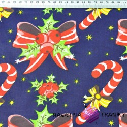 Cotton Christmas pattern with bows and sticks on a navy blue background