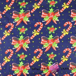 Cotton Christmas pattern with bows and sticks on a navy blue background