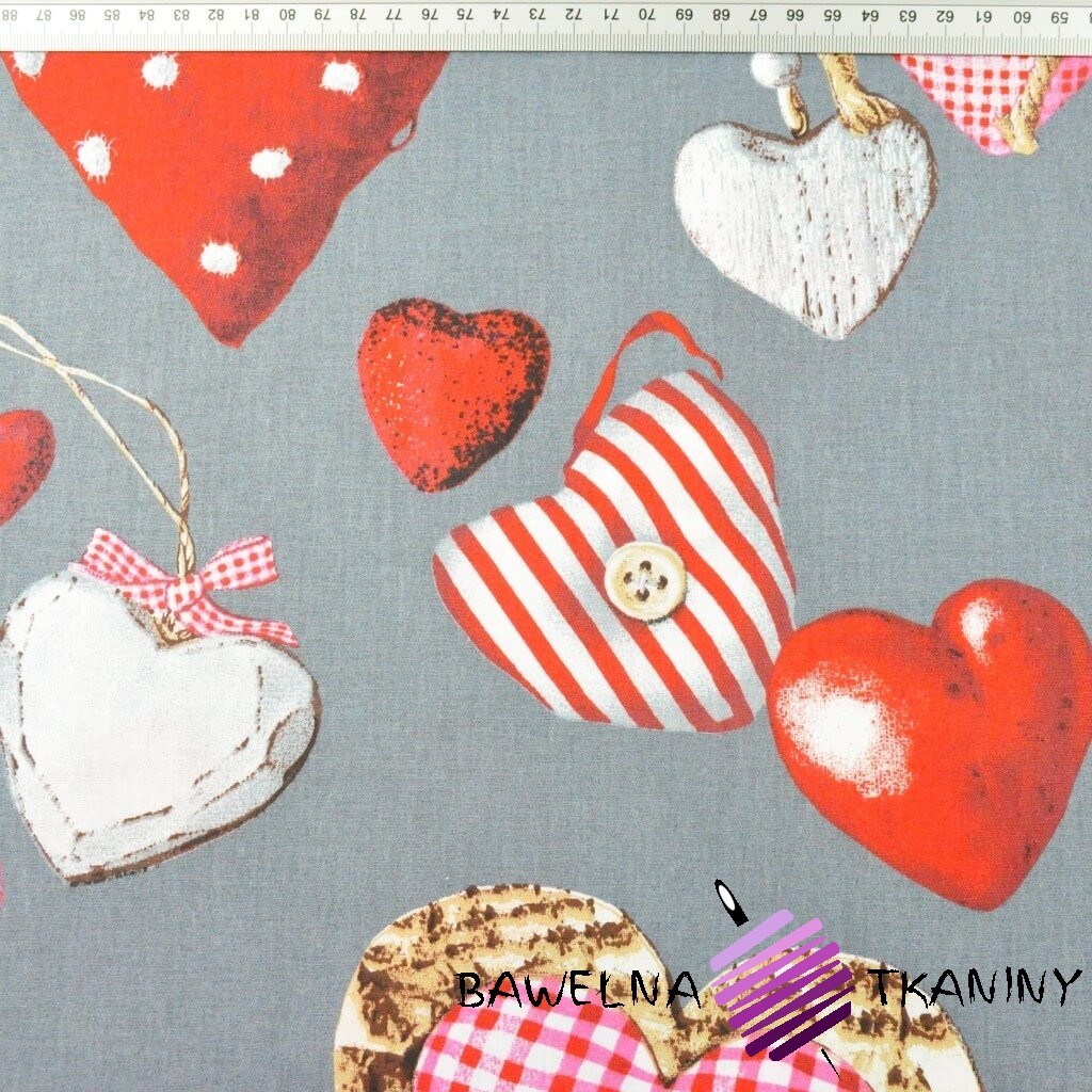 Cotton red pendants hearts on gray background
