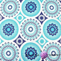 Cotton pattern of turquoise mandalas on a white background