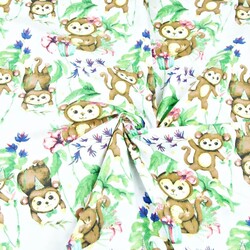 Cotton monkeys on a birthday party on a white background