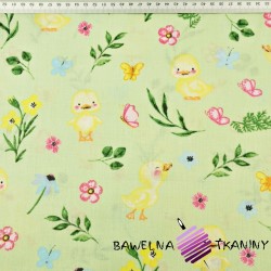 Cotton Yellow ducklings with flowers on a green background