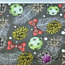 Cotton Christmas baubles and pine cones on a dark gray background