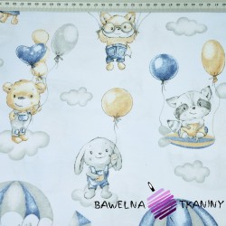 Cotton cuddly toys with beige-blue parachutes on a light blue background