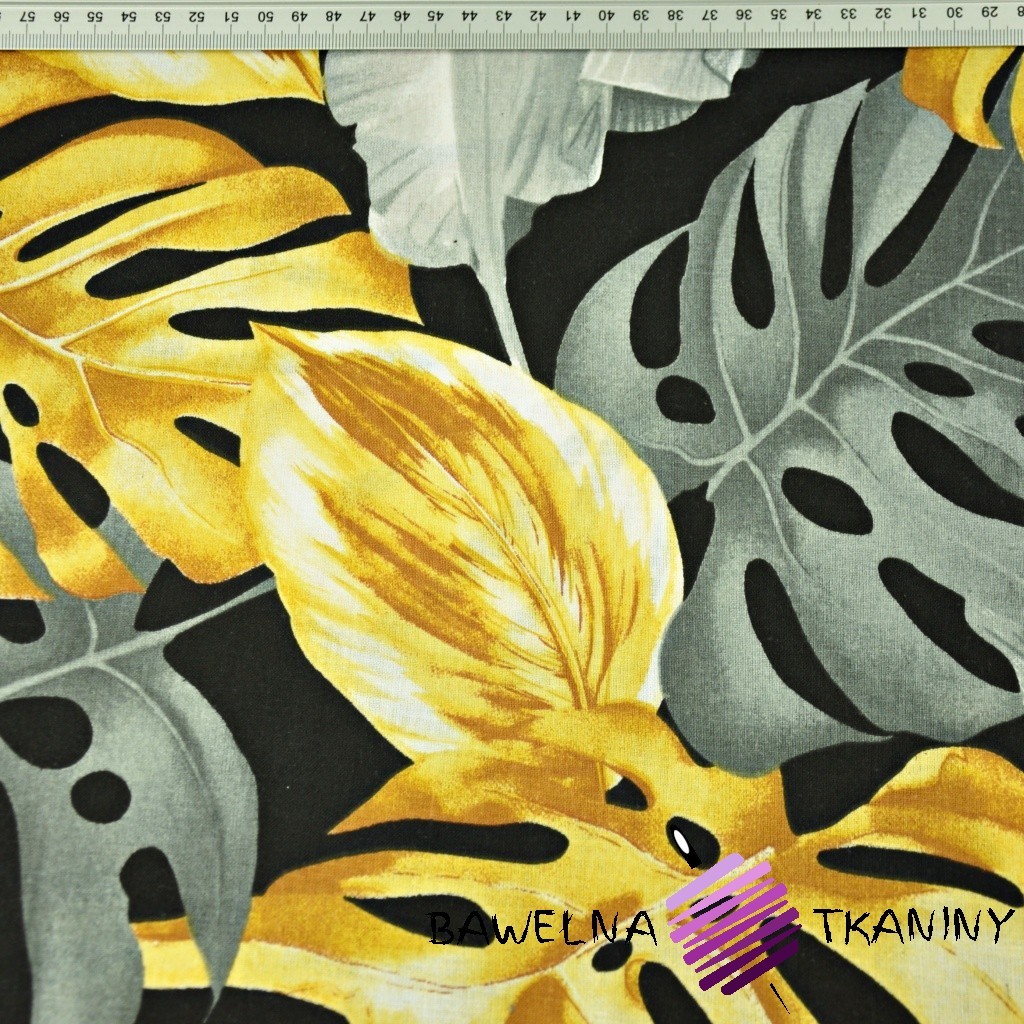 Cotton Cotton 100% monstera and banana leaves, gold gray on a black background