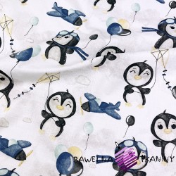 Cotton penguins with blue balloons on a white background