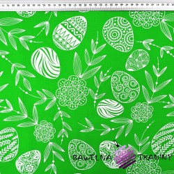 Cotton easter pattern with easter eggs on a green background