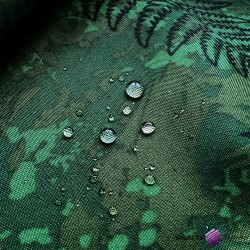 Waterproof fabric fern leaves on a green background