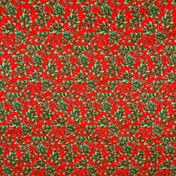 Patterned cotton satin with green holly on a red background