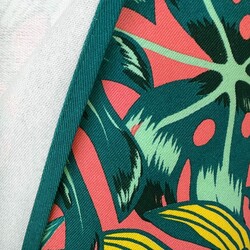 Sun lounger fabric with monstera leaves on a coral background