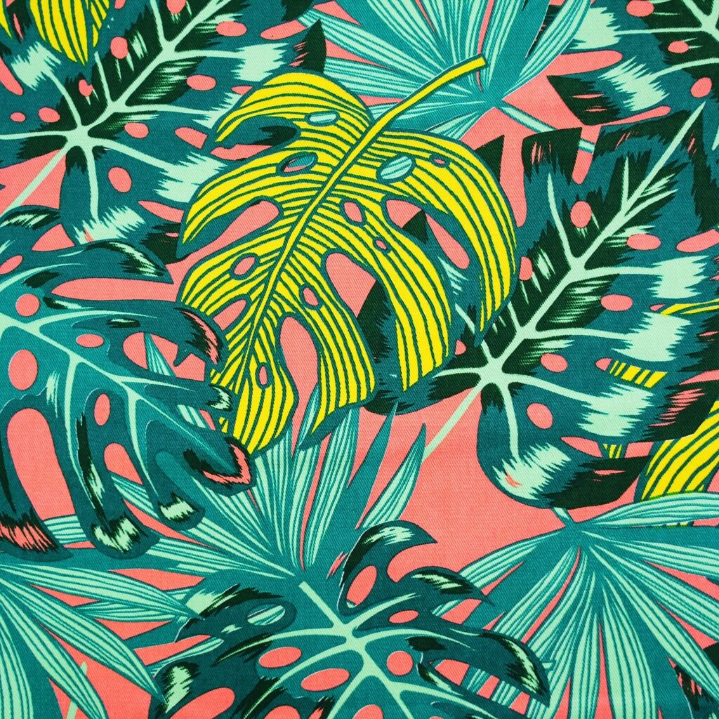 Sun lounger fabric with monstera leaves on a coral background