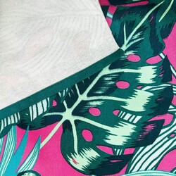 Sun lounger fabric with monstera leaves on a fuchsia background