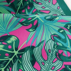 Sun lounger fabric with monstera leaves on a fuchsia background