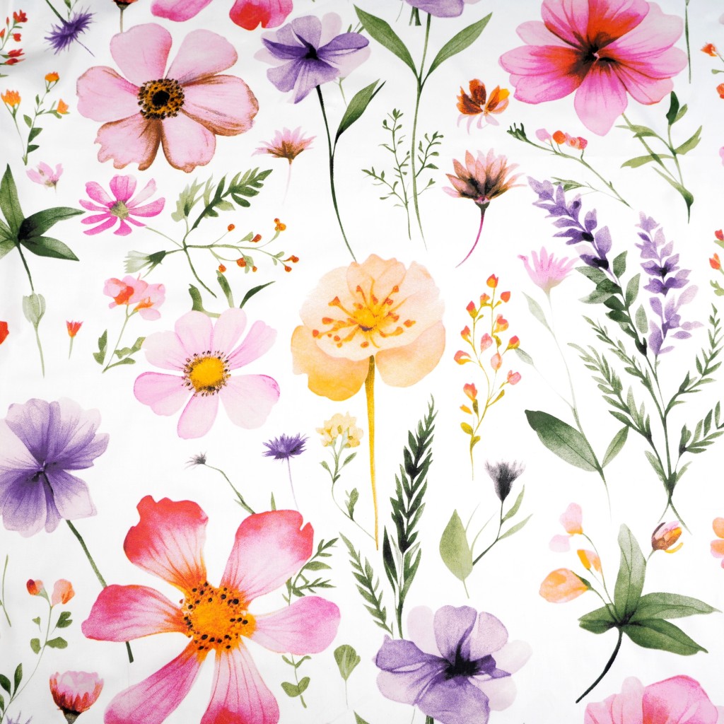 Patterned cotton satin with pink apricot violet field flowers on a white background