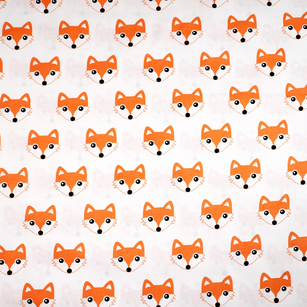 Cotton orange foxes on white background