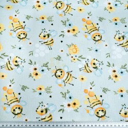 Cotton 100% bees with flowers on a blue meadow