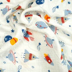 Double gauze muslin with rockets in space print