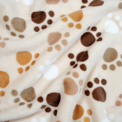 Soft fleece brown paws on beige background