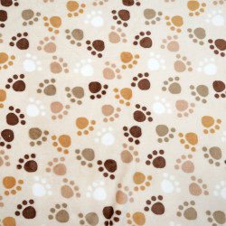 Soft fleece brown paws on beige background