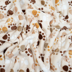 Soft fleece brown paws on beige background