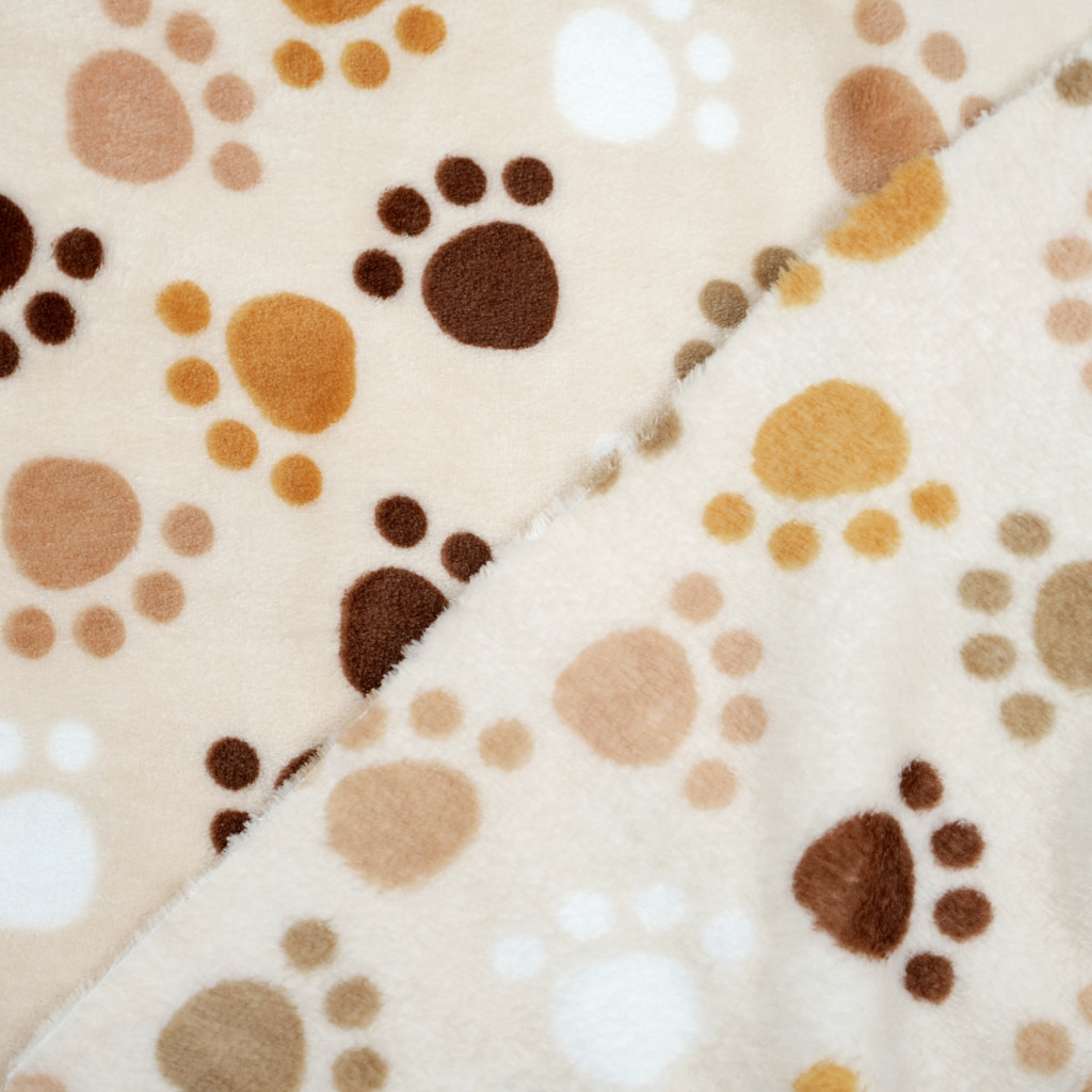 Soft fleece brown paws on beige background