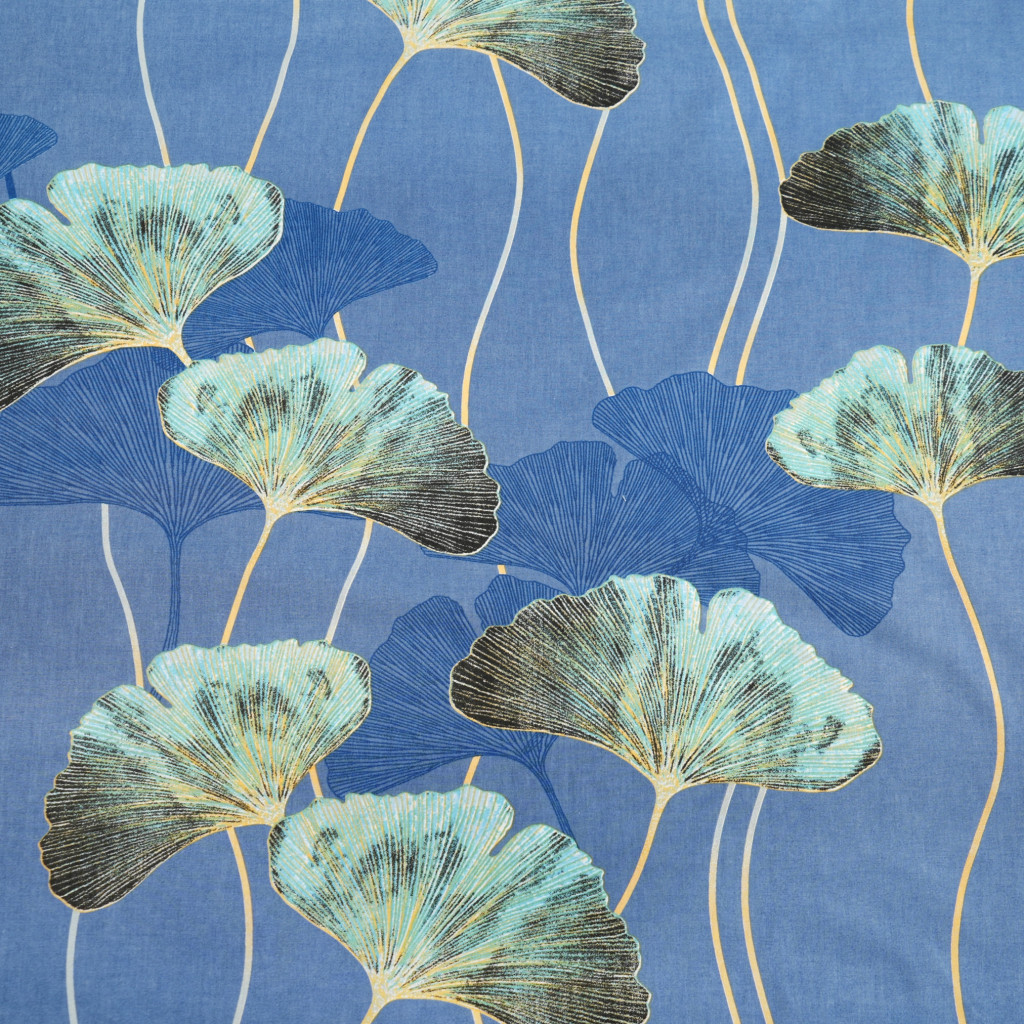 Cotton 100% turquoise ginkgo leaves on a denim background