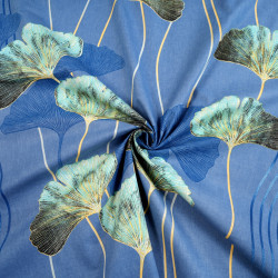 Cotton 100% turquoise ginkgo leaves on a denim background