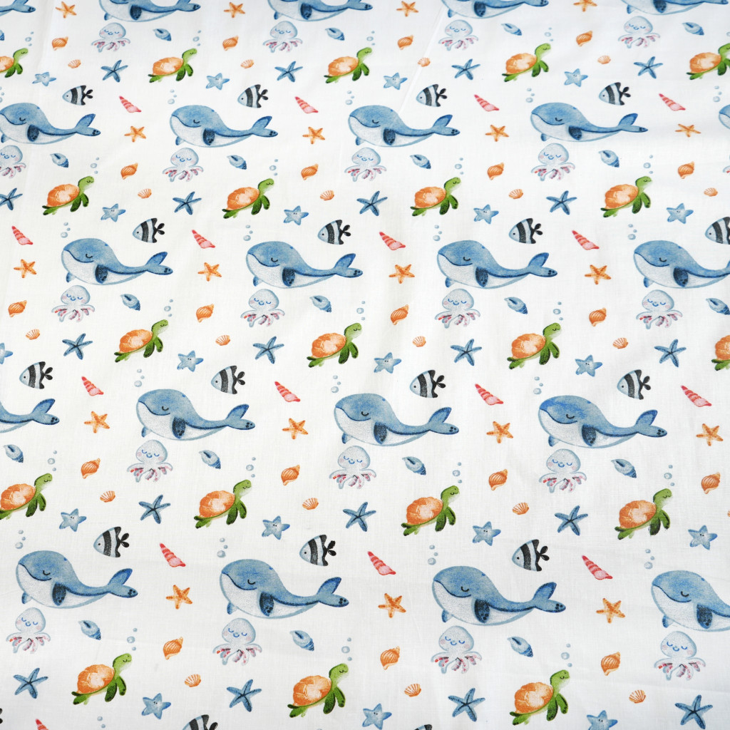 Cotton 100% whales and turtles on a white background