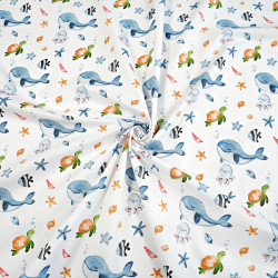 Cotton 100% whales and turtles on a white background