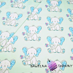 Cotton blue elephants with flowers on light blue background