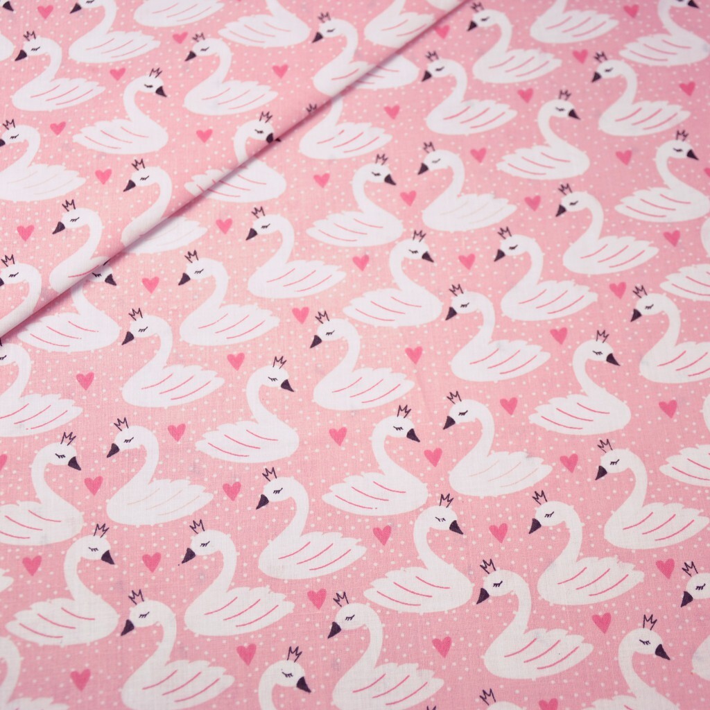 Cotton swans on pink background