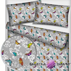 Cotton colourful butterflies with flowers on gray background