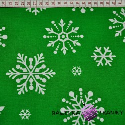 Cotton big white snowflake on green background