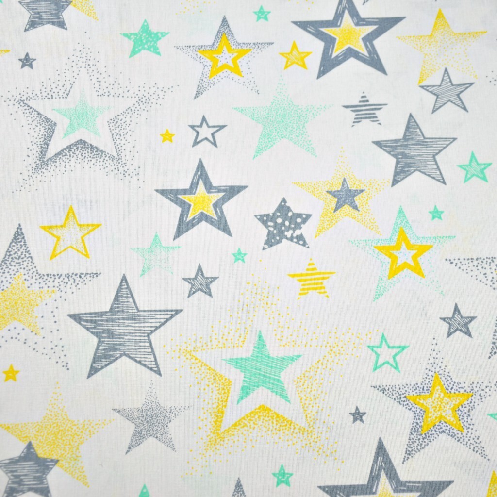 Cotton Stars patterned gray and yellow on a white background