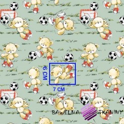 Cotton teddy bears footballers on a green background