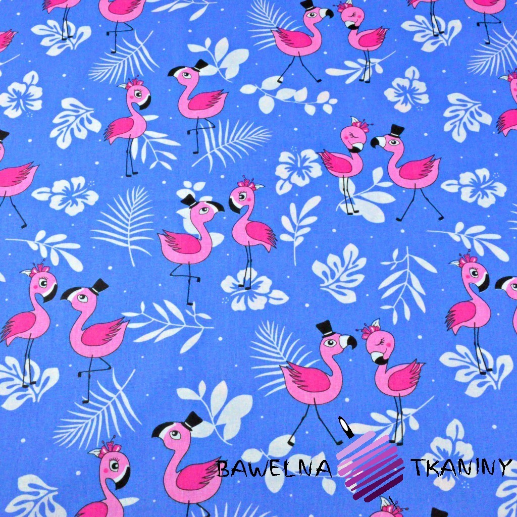Cotton pink flamingos with leaves on a blue background