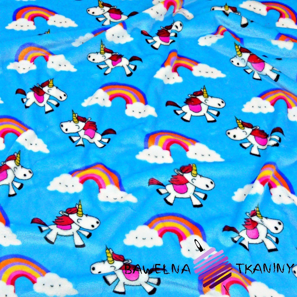Soft fleeece unicorns on a blue background