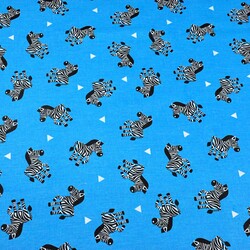 Cotton zebras on blue background