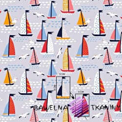 Cotton colorful sailboats on a gray background
